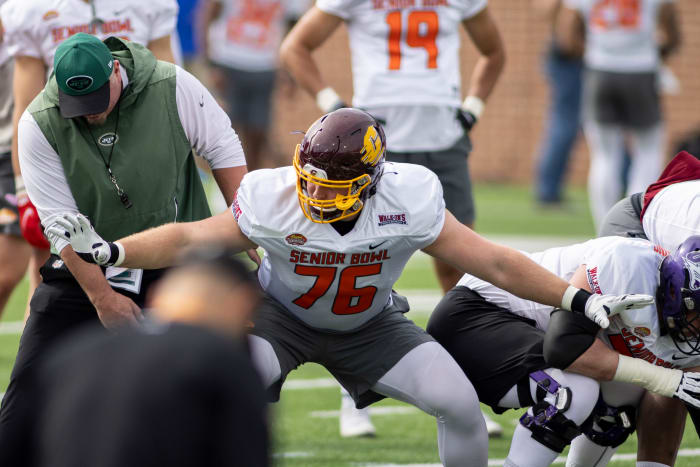 Feb 1, 2022; Mobile, AL, USA; National offensive lineman Bernhard Raimann of Central Michigan (76) works with a coach during National practice for the 2022 Senior Bowl at Hancock Whitney Stadium.
